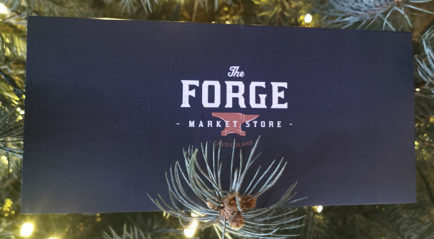 Gift card perched on branch of Christmas tree